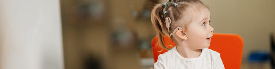 Young girl with a cochlear implant.