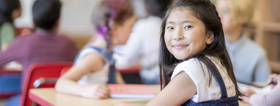 Elementary school student in classroom.