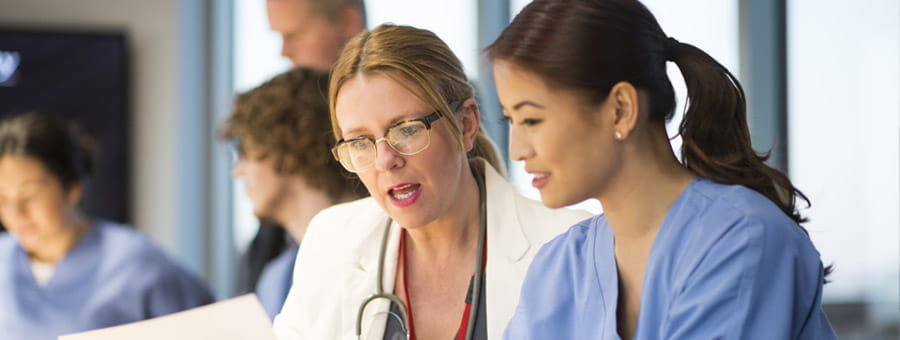 Nurse and manager discussing a case.