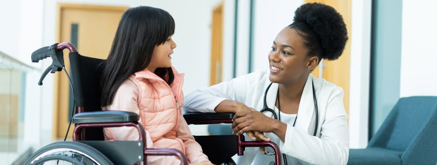 Doctor speaking with child patient.