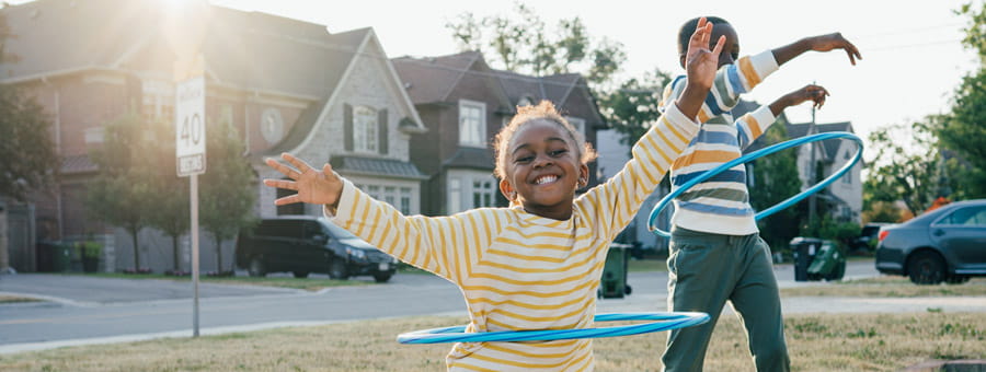 Child using a hula hoop.