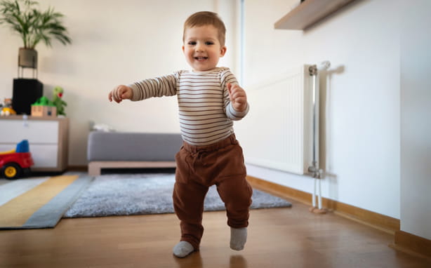 toddler taking first steps