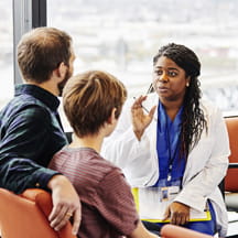 Doctor talking with parent and child.