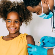 Girl receiving COVID vaccination